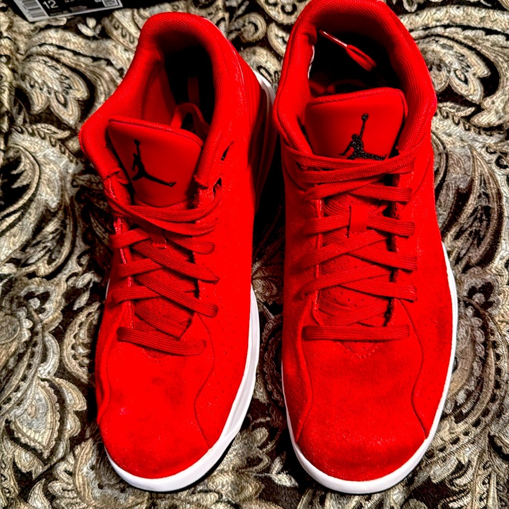 Great condition; size: 11.5 Red Jordans